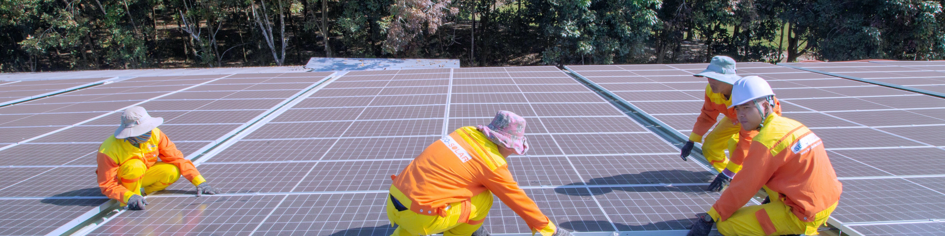 People working on solar panels