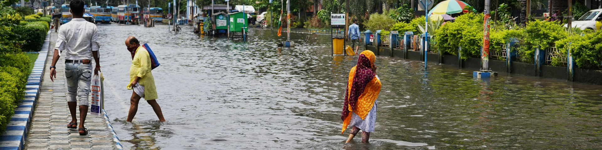 People crossing a flooded street